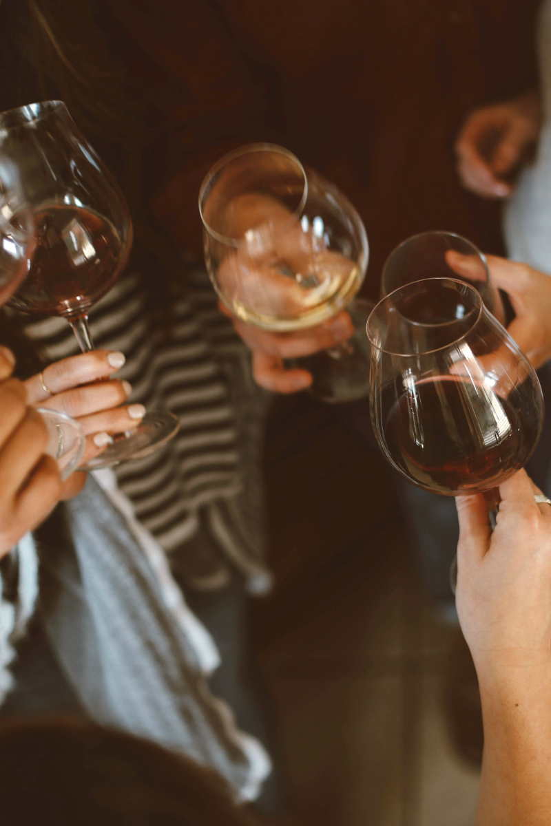 how to live an elegant life on a budget women clinking wine glasses