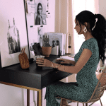 elegant woman sitting at a desk