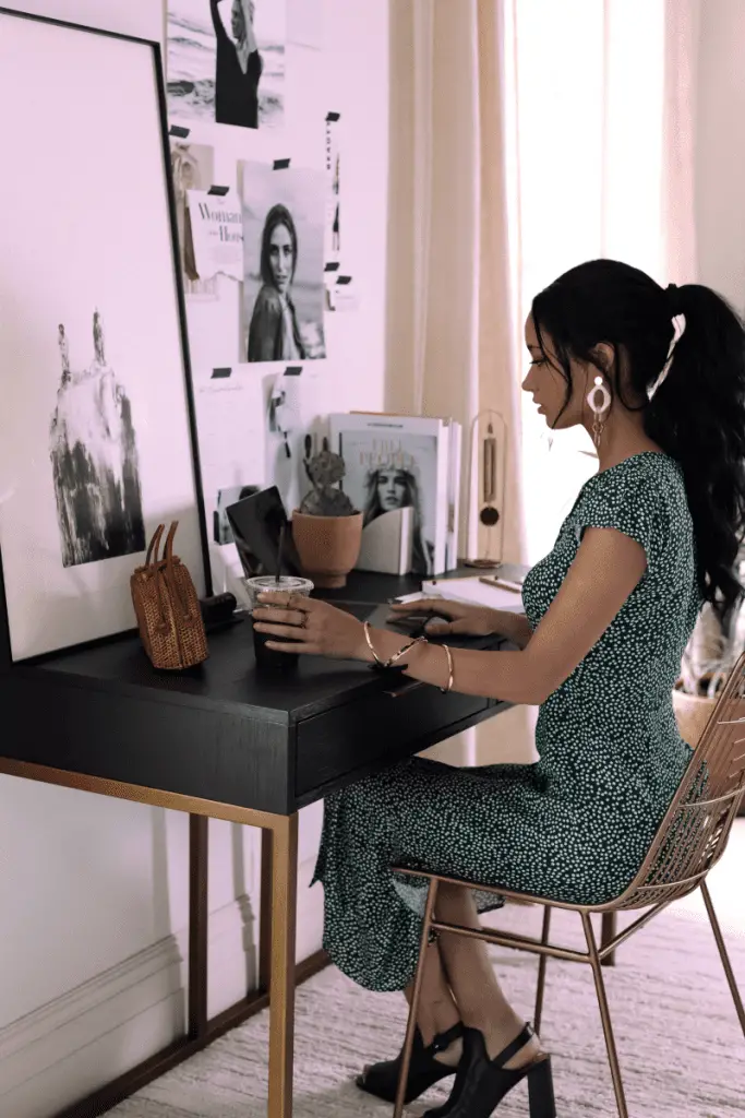 elegant woman sitting at a desk