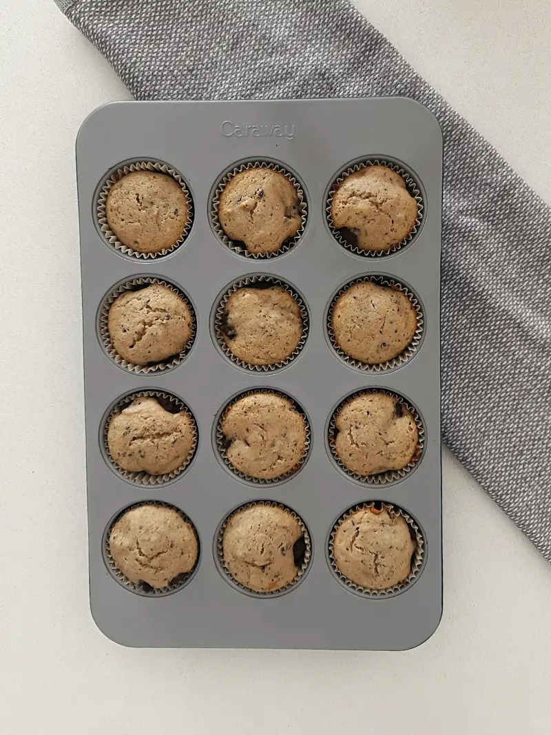 muffins in muffin tin on white countertop