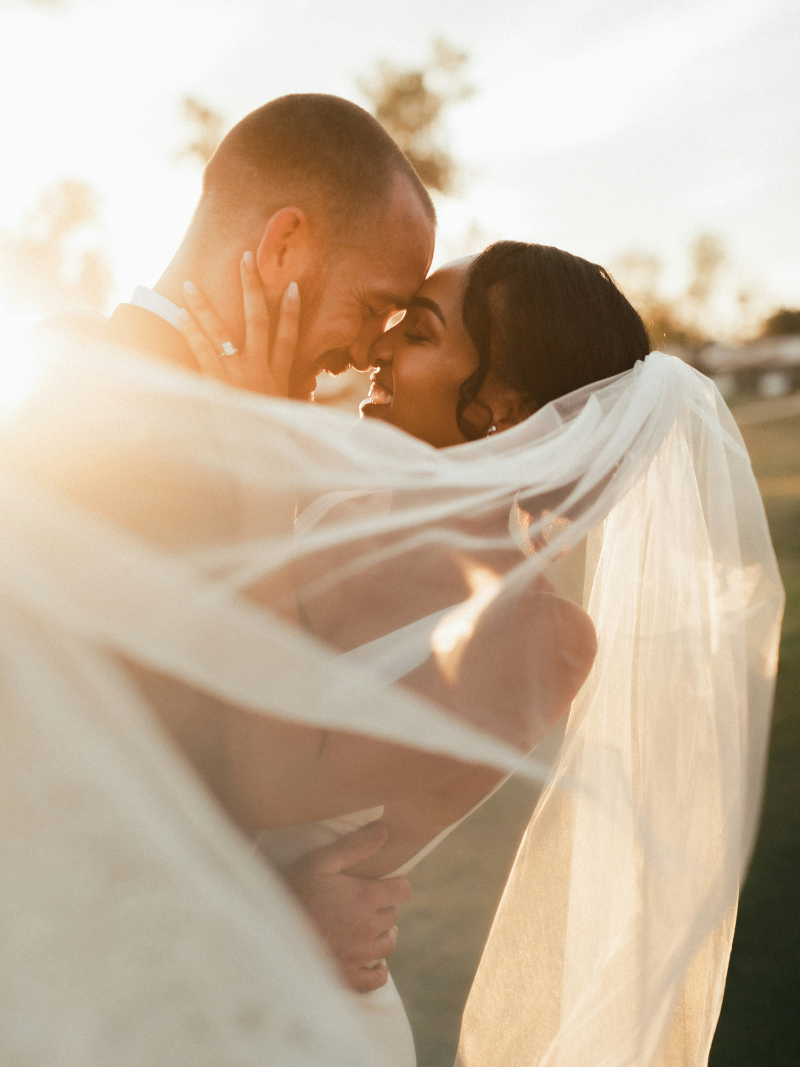 wedding photo with sunset in the background