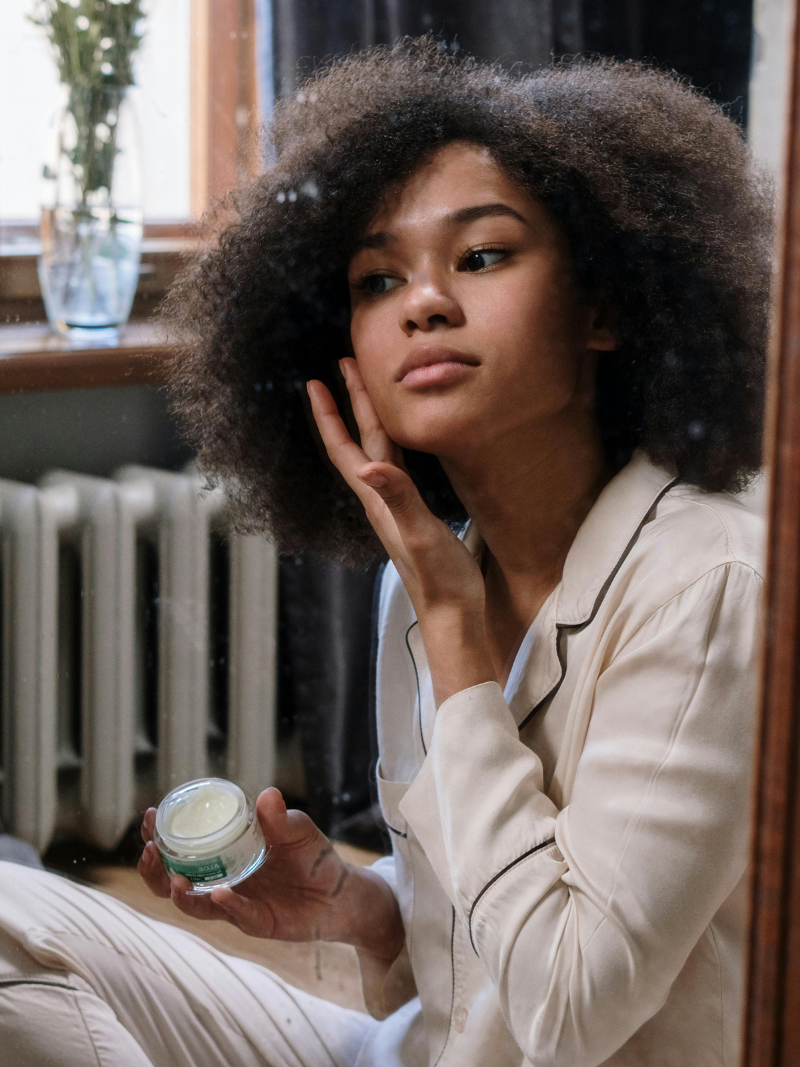 woman applying skincare products