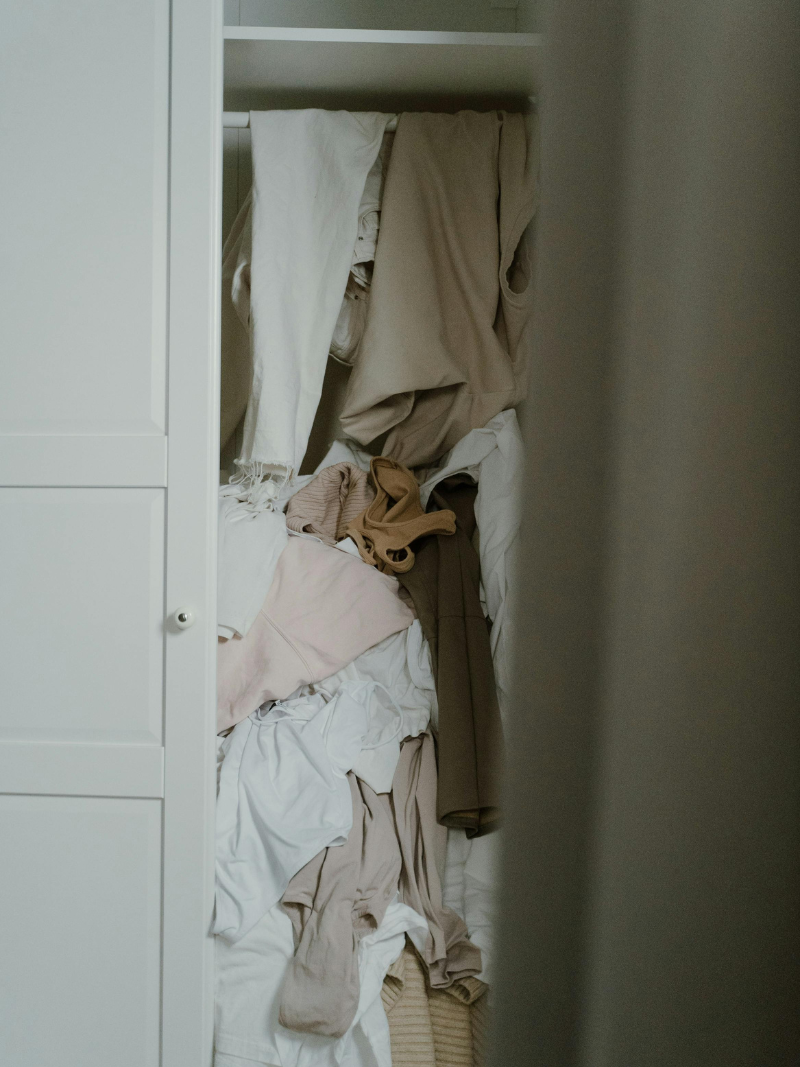 very messy and over stuffed closet
