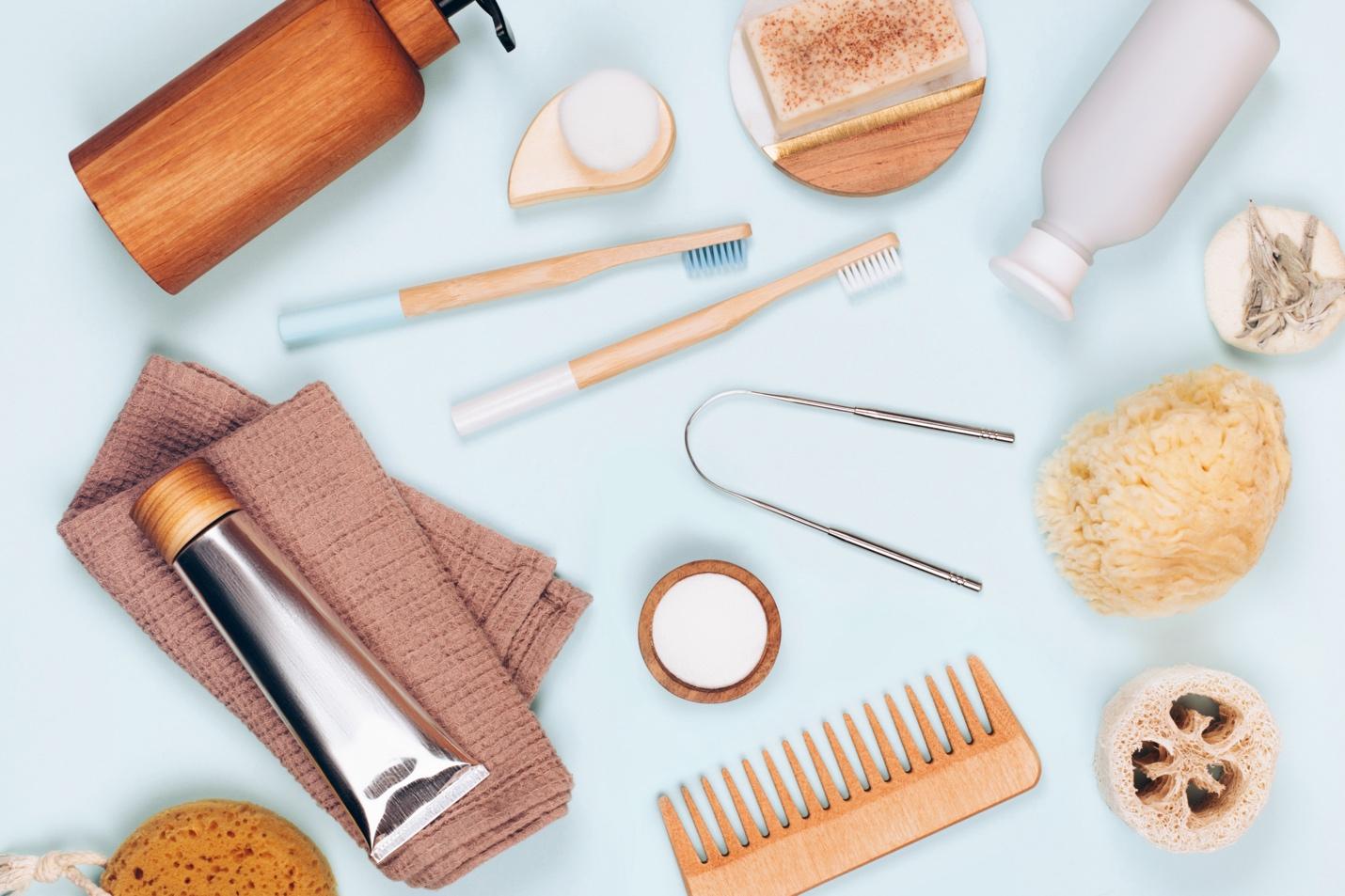 beauty products laid flat on a light blue surface